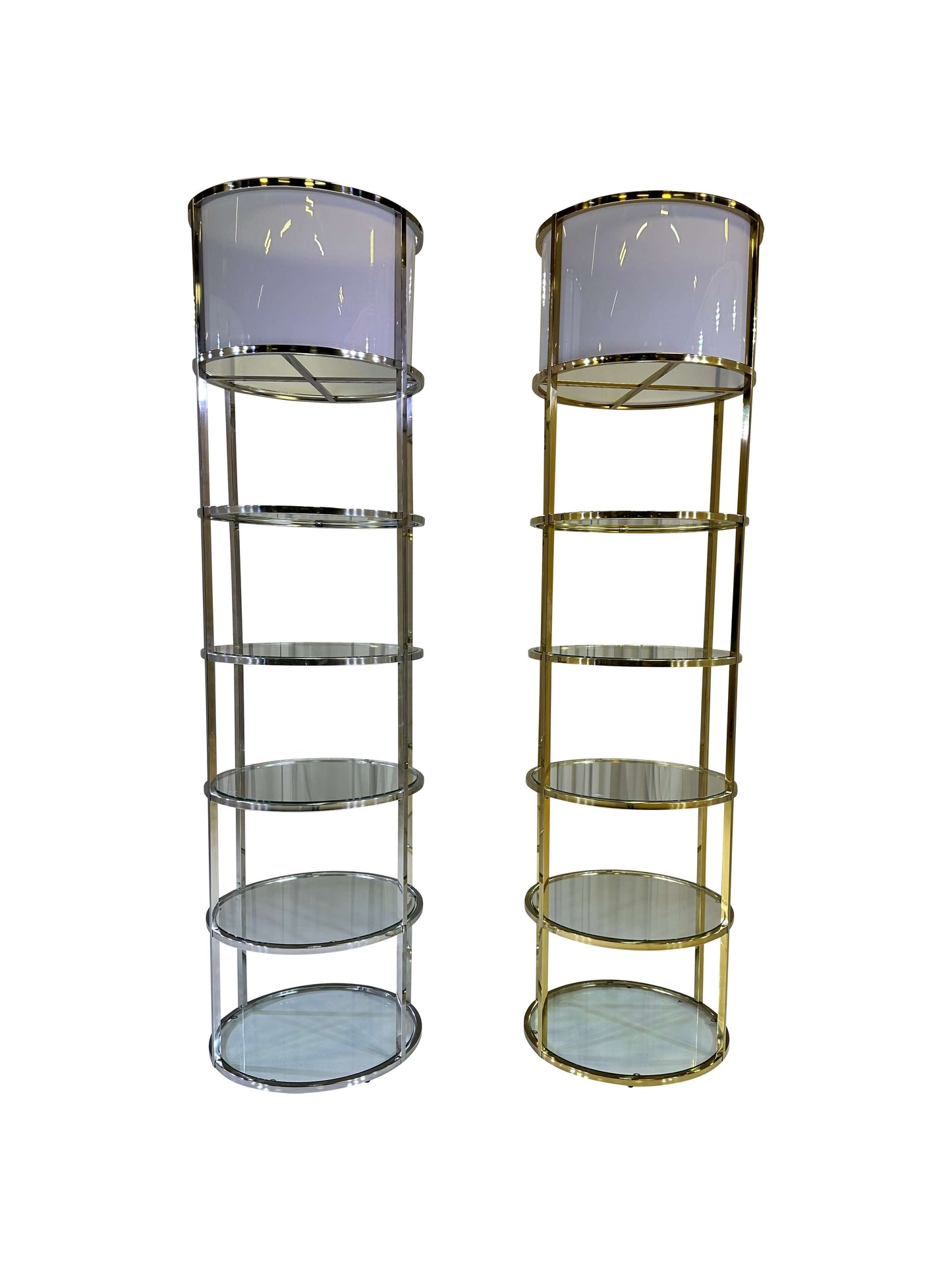 RESERVE DISPLAY UNIT - GOLD - H 88" / D 24" | H (Shelf) 14" LLL Reserve Display Unit in gold is a multi-tiered shelving solution designed to showcase your items. Featuring a sleek, cylindrical design with gold frames and clear glass shelves, this unit off