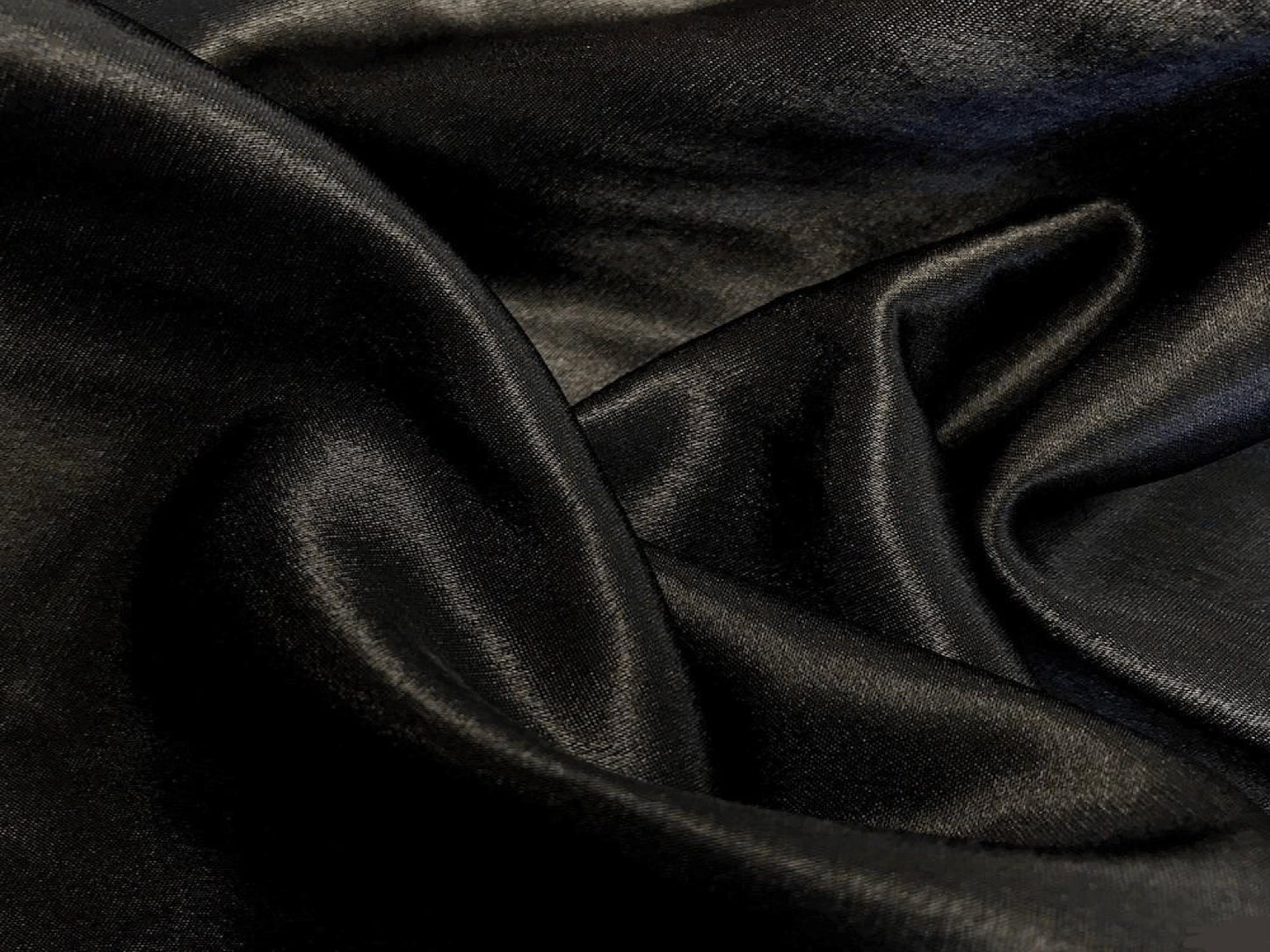 POLY PREMIER DRAPE - BLACK - H 15' / W 54" LLL's Poly Drape - Black adds an elegant touch to any room, featuring a lightweight polyester material with a sleek black finish. Its crisp texture ensures a wrinkle-free drape that can be styled to fit any desir