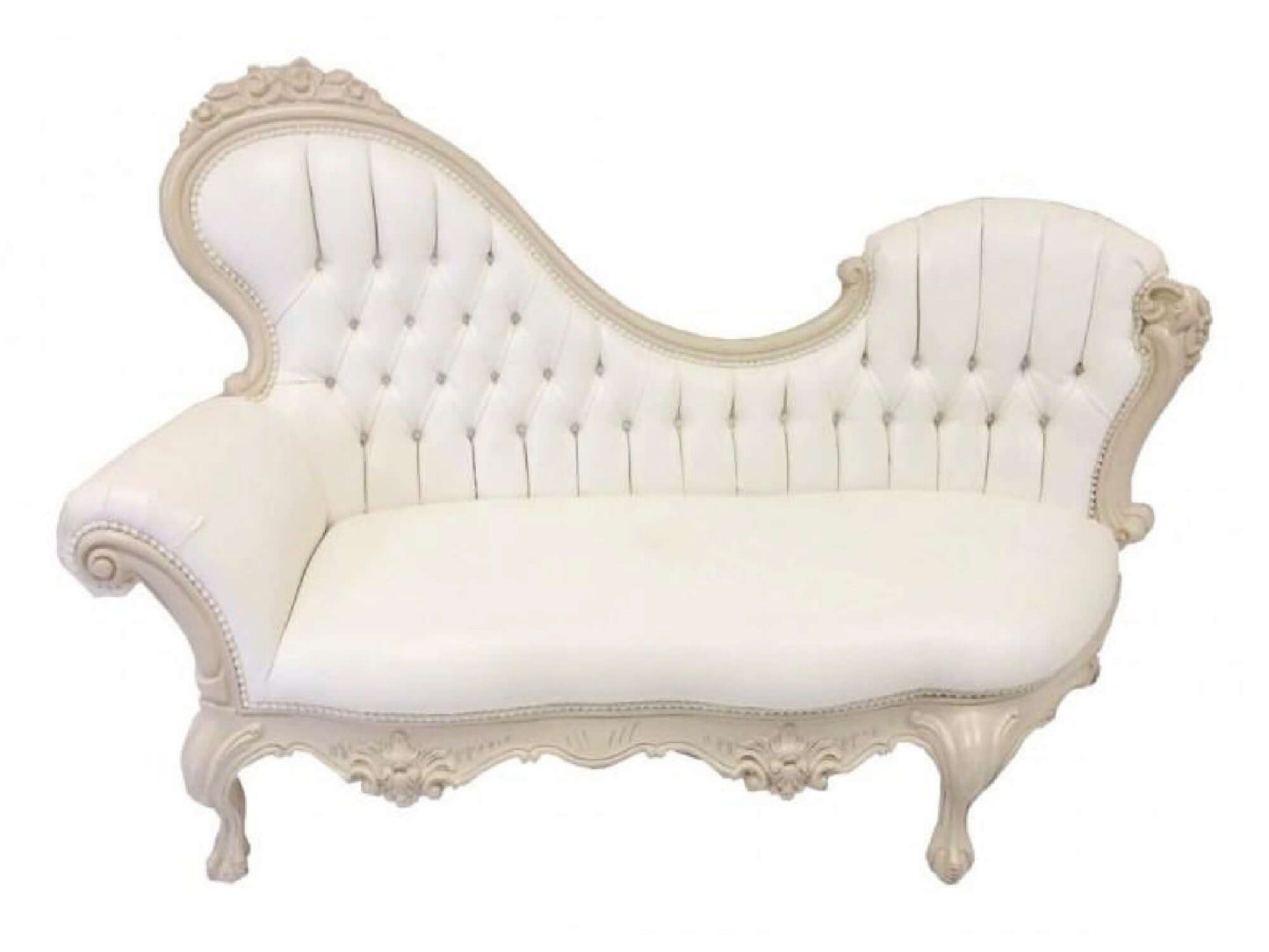 ROYAL MAJESTY CHAISE LOUNGE - H 44" / W 71" / D 32" The Royal Majesty Chaise Lounge is an off-white button tufted leather with elaborate cream carving detail. This chaise is a beautiful addition to any event design providing and elegant seating solution t
