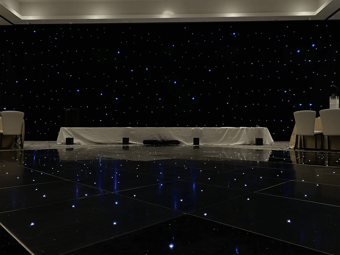 STARLIT DRAPERY - Dimensions: W 22' x H 20' A beautiful velour drape filled with hundreds of LEDs to recreate a starry night essence for your event. The lights twinkle at random to give you and your guests an atmosphere that is unmatched.